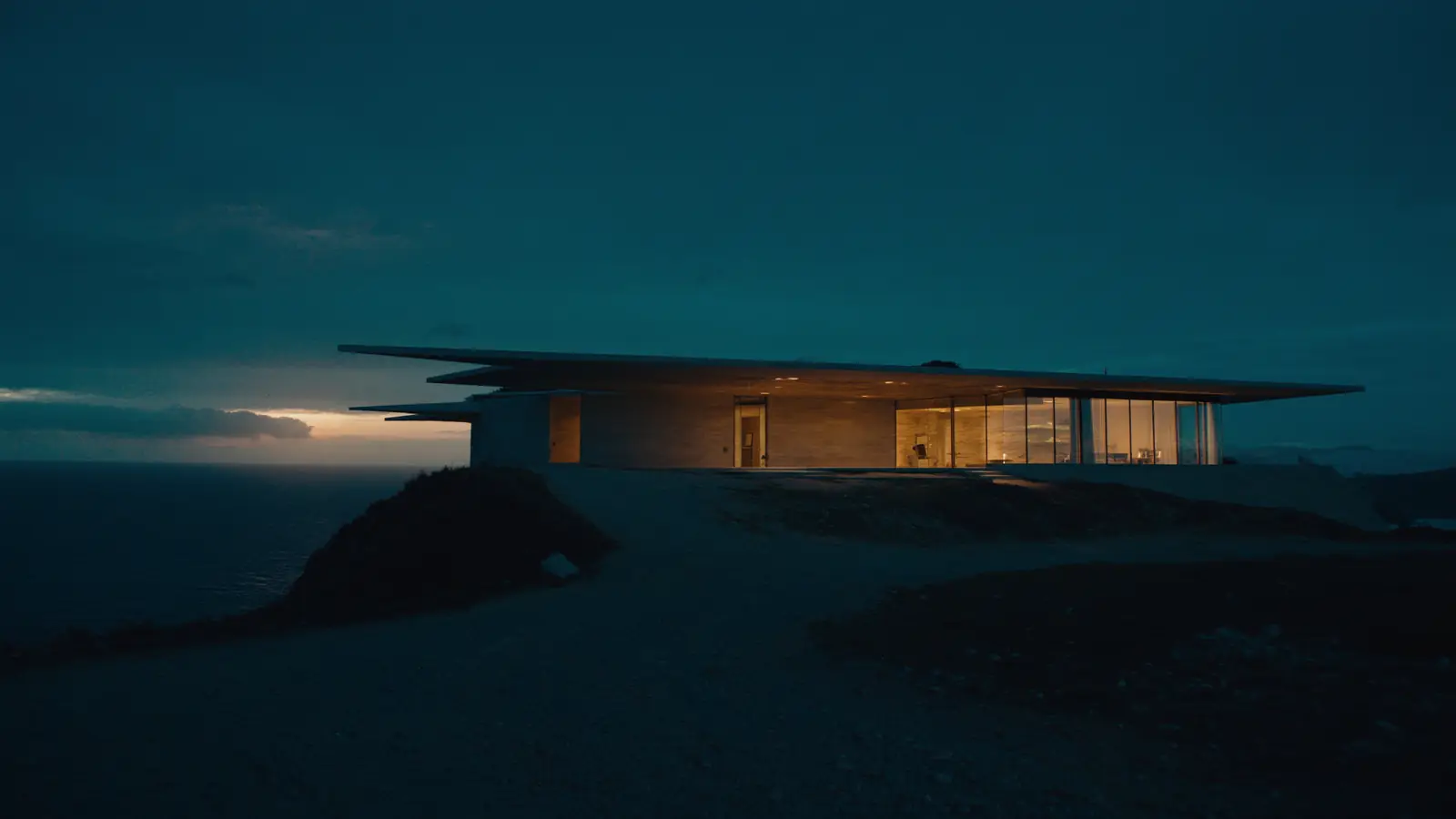 The finished pavilion on its headland at dusk